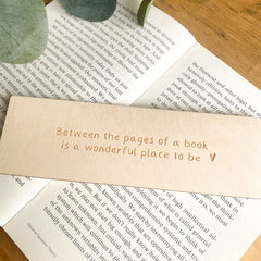 'Between the pages of a book is a wonderful place to be'' wooden bookmark